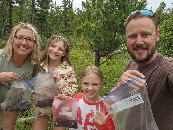 The Penske family with a berry harvest