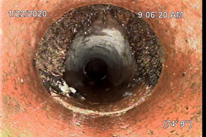 In-pipe camera view from a sewer scope with on-screen footage counter